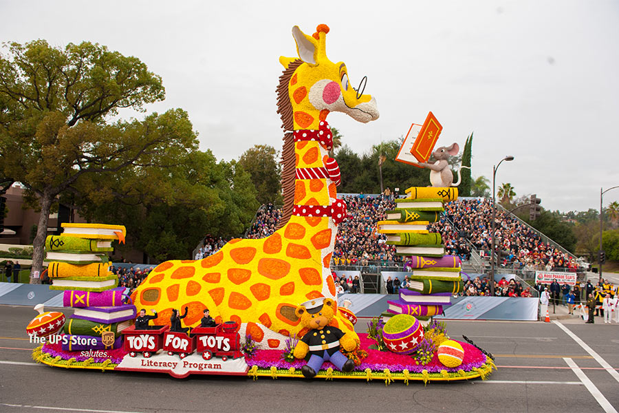 The UPS Store's 2017 float, featuring a 42 foot giraffe with animal friends